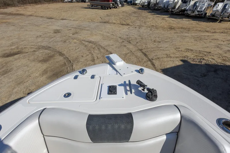 Slide: The Image of 2019 Wellcraft 262 Fisherman boat, bow view, parked on sandy ground. - 15