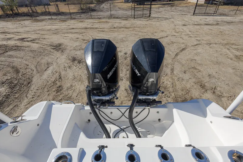 Slide: The Image of 2019 Wellcraft 262 Fisherman boat with dual Mercury outboard engines. - 17