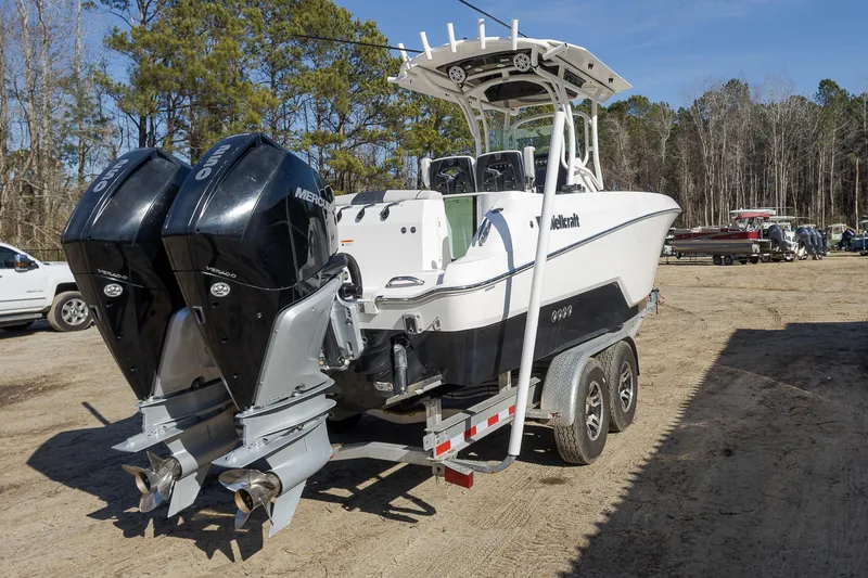 Slide: The Image of 2019 Wellcraft 262 Fisherman boat with dual Mercury engines on a trailer. - 3