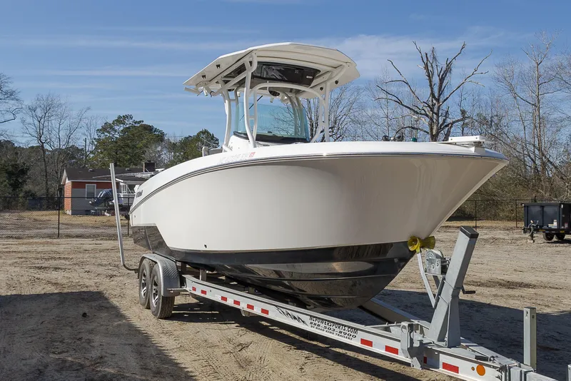 Slide: The Image of 2019 Wellcraft 262 Fisherman boat on trailer, parked outdoors. - 5