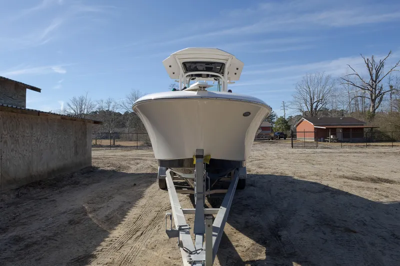 Slide: The Image of 2019 Wellcraft 262 Fisherman boat on trailer, parked outdoors. - 7