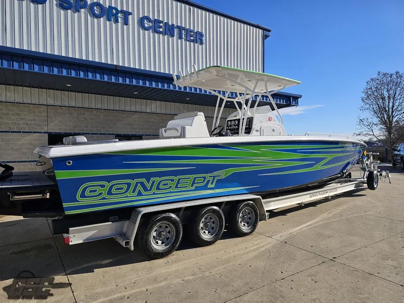 Slide: The Image of 2014 Concept 36' CC boat with vibrant blue and green design on a trailer. - 11