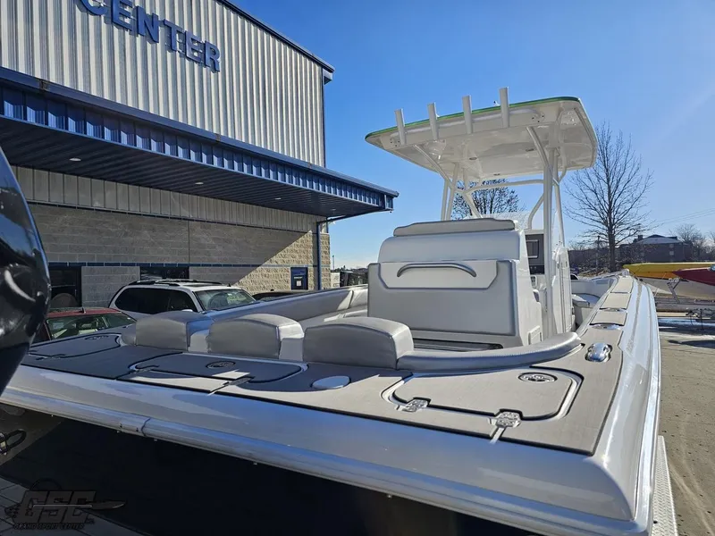 Slide: The Image of 2014 Concept 36' CC boat at dealership, showcasing sleek design and spacious deck. - 14