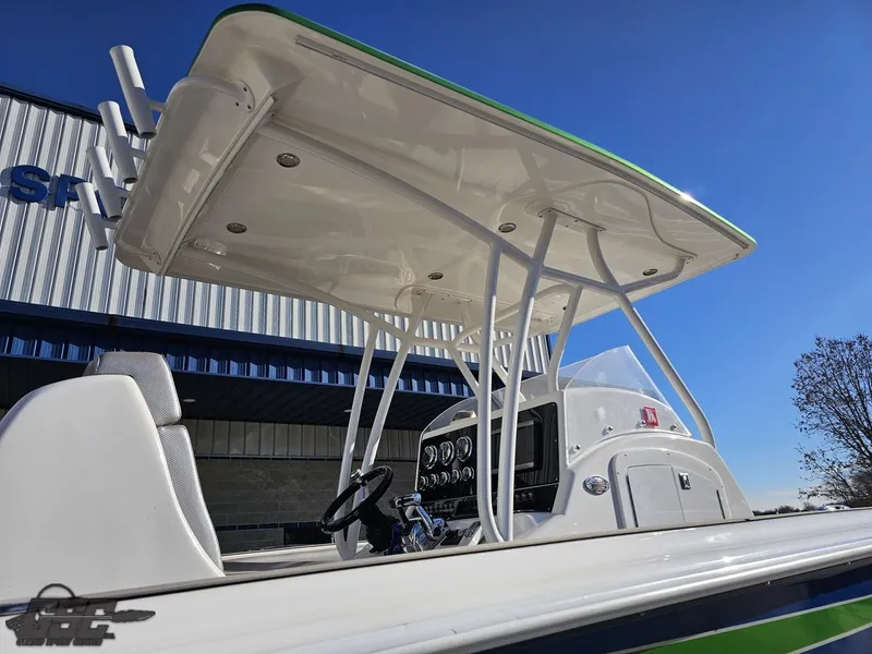 Slide: The Image of 2014 Concept 36' CC boat with T-top and control panel, docked outdoors. - 15