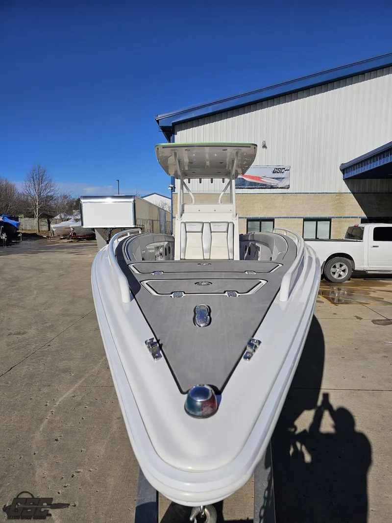 Slide: The Image of 2014 Concept 36' CC boat, white exterior, parked outdoors near a building. - 22