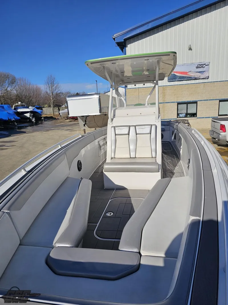 Slide: The Image of 2014 Concept 36' CC boat with spacious seating and modern design, docked outdoors. - 23