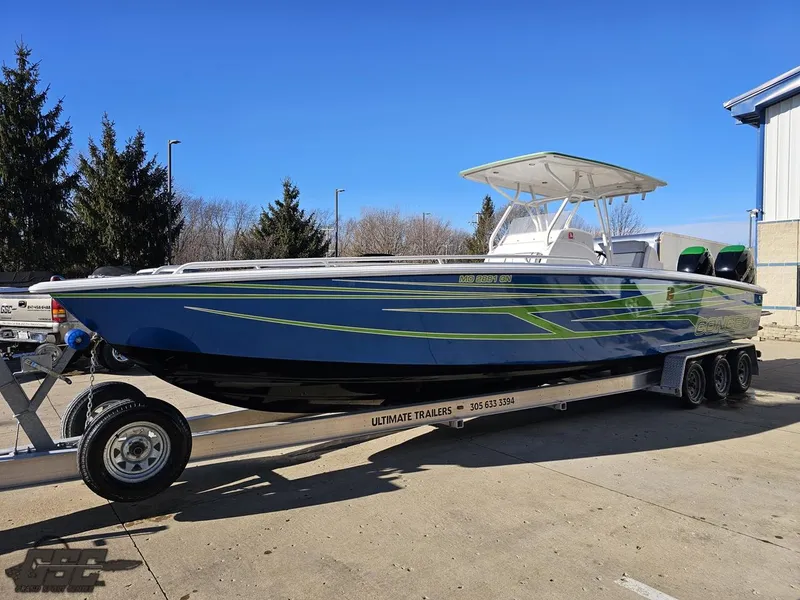 Slide: The Image of 2014 Concept 36' CC boat on trailer, blue and green design, parked outdoors. - 26