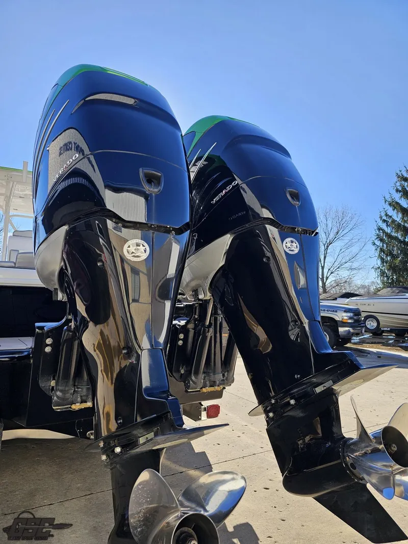 Slide: The Image of Twin outboard motors on a 2014 Concept 36' CC boat, under clear blue sky. - 43