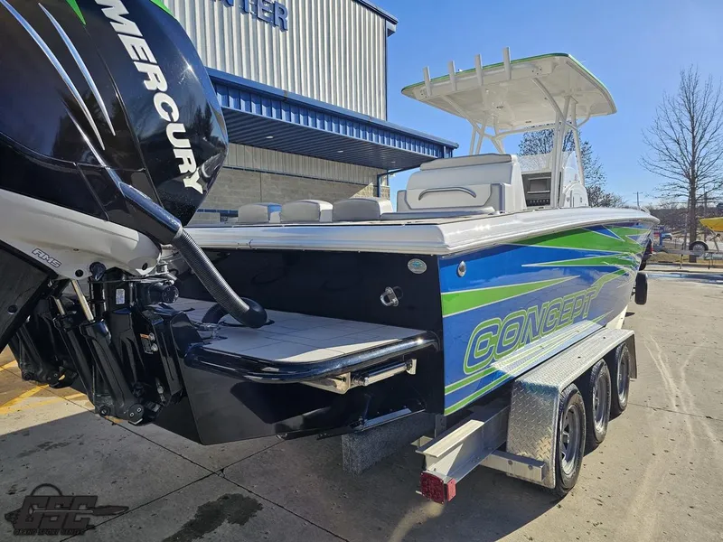 Slide: The Image of 2014 Concept 36' CC boat with Mercury engine, parked on a trailer. - 48