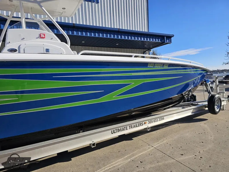 Slide: The Image of 2014 Concept 36' CC boat with blue and green design on a trailer. - 5