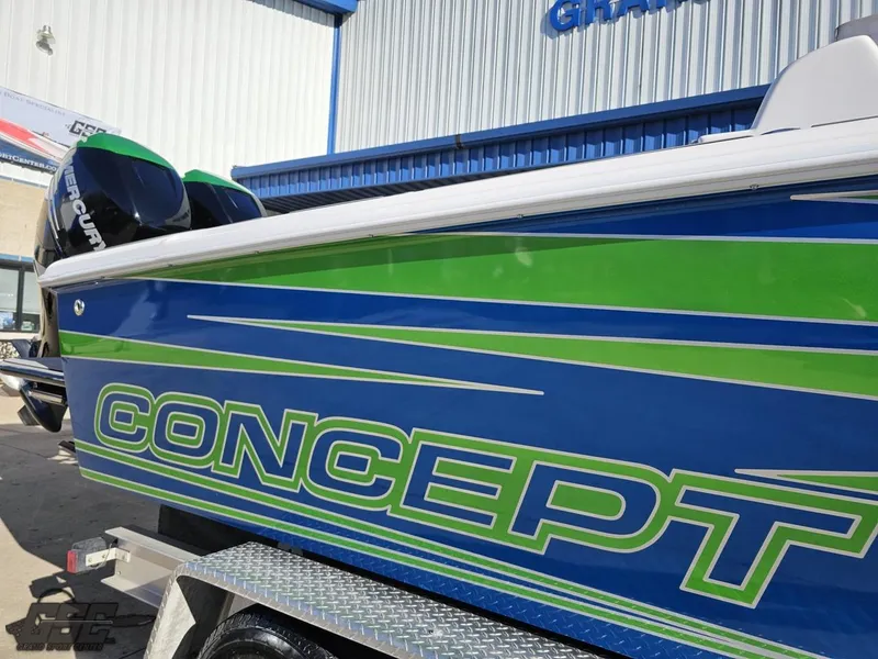 Slide: The Image of 2014 Concept 36' CC boat with blue and green design on trailer. - 7