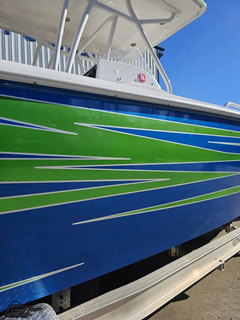 Slide: The Image of 2014 Concept 36' CC boat with vibrant blue and green stripes on the side. - 8