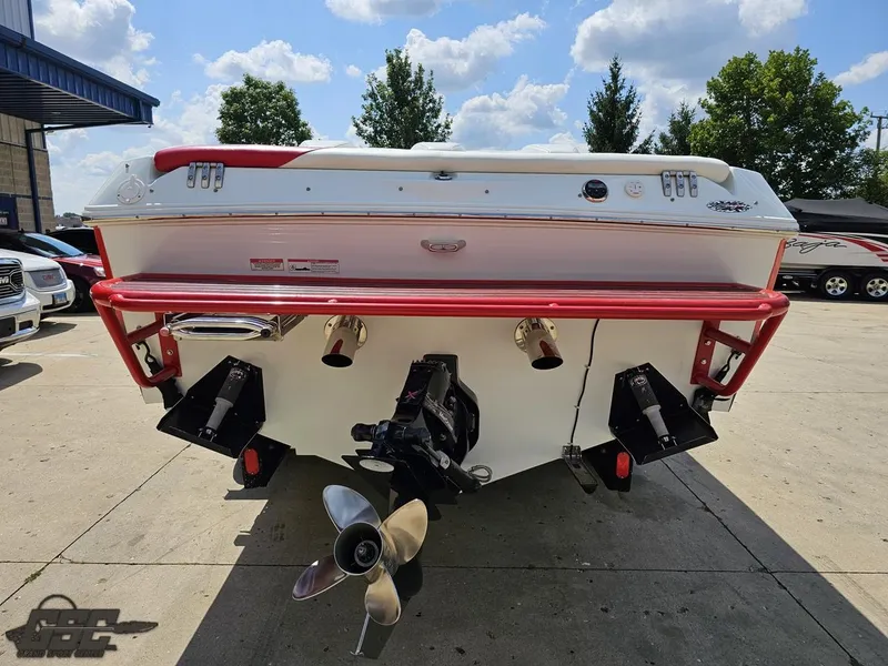 Slide: The Image of 2007 Baja 26 Outlaw boat rear view with dual propellers and red accents. - 32