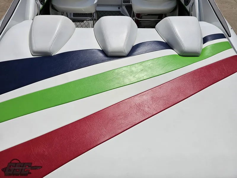Slide: The Image of 2007 Baja 26 Outlaw boat interior with colorful striped upholstery design. - 39