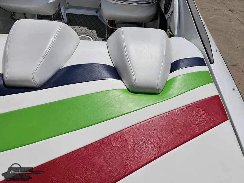 Slide: The Image of 2007 Baja 26 Outlaw boat seats with colorful striped upholstery. - 42