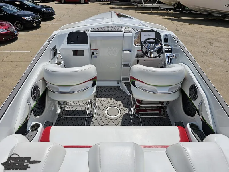Slide: The Image of 2007 Baja 26 Outlaw boat interior with white seating and modern dashboard. - 43