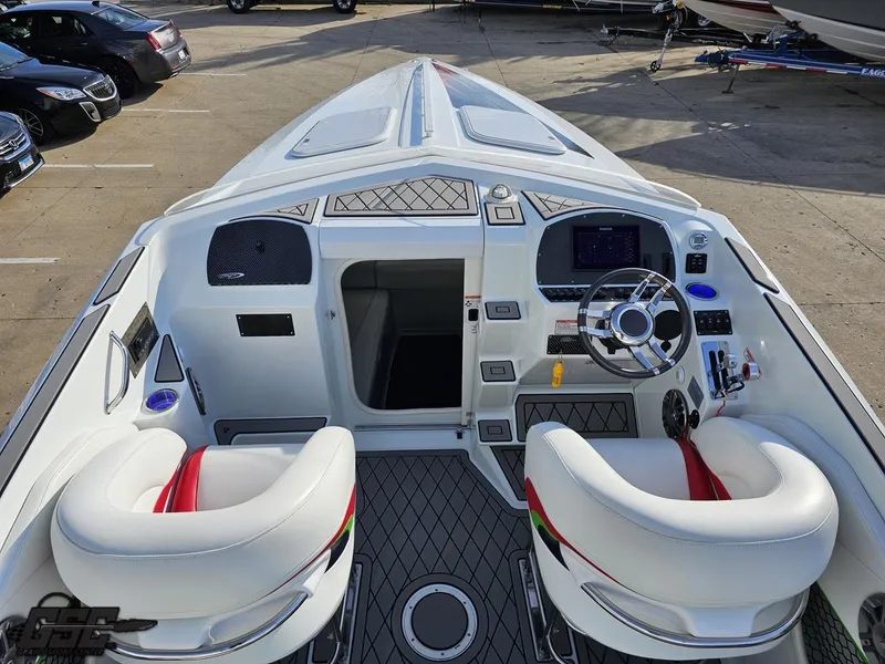Slide: The Image of 2007 Baja 26 Outlaw boat cockpit with dual seats and modern dashboard controls. - 45