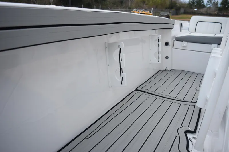 Slide: The Image of 2025 Yamaha Boats 195 FSH Sport interior with sleek, modern design and non-slip flooring. - 12