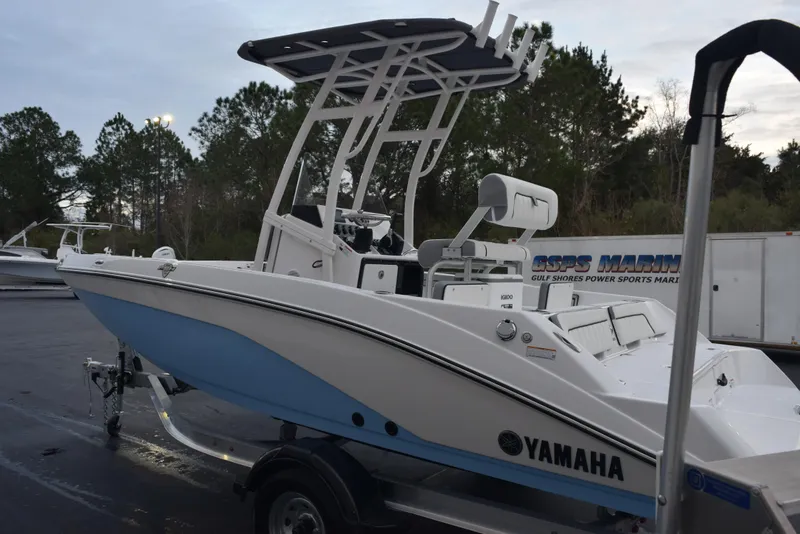 Slide: The Image of 2025 Yamaha Boats 195 FSH Sport on trailer, parked outdoors. - 6