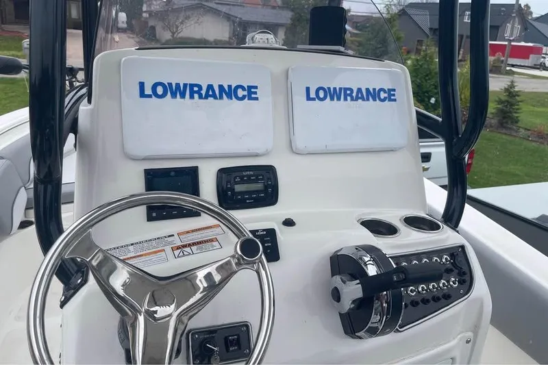 Slide: The Image of 2022 NauticStar 2302 Legacy boat dashboard with Lowrance electronics. - 5
