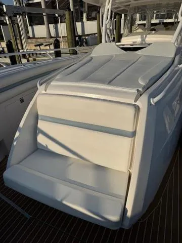 Slide: The Image of 2016 Intrepid 475 Panacea boat with cushioned seating and sleek design. - 19