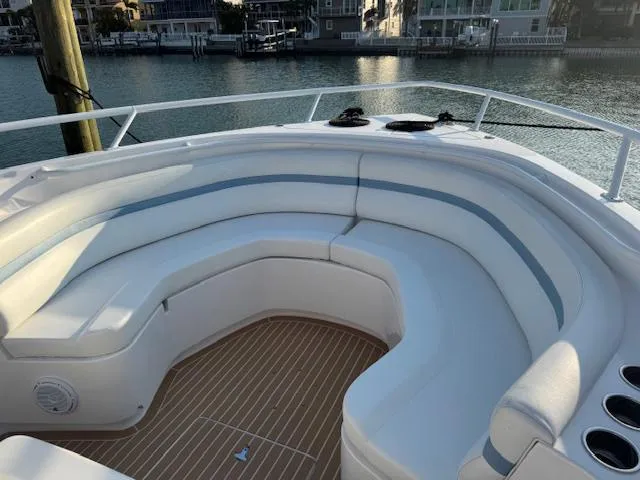 Slide: The Image of 2016 Intrepid 475 Panacea boat with spacious seating area and waterfront view. - 21