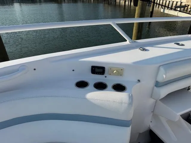 Slide: The Image of 2016 Intrepid 475 Panacea boat interior with cup holders and control panel. - 22