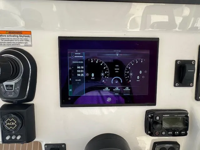 Slide: The Image of Dashboard of a 2016 Intrepid 475 Panacea boat with digital display and controls. - 26