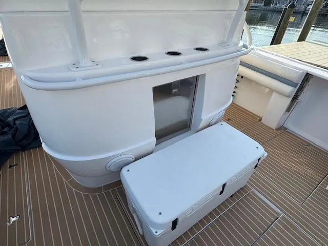 Slide: The Image of 2016 Intrepid 475 Panacea boat deck with storage and seating area. - 29