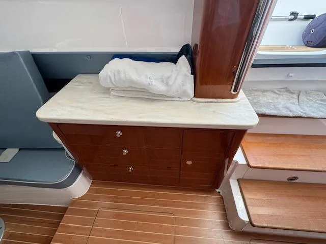 Slide: The Image of Interior of 2016 Intrepid 475 Panacea with wooden cabinetry and seating. - 41