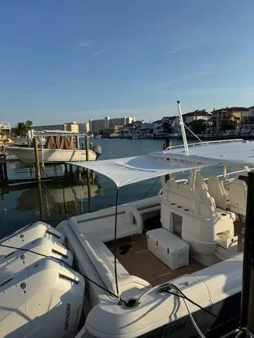 Slide: The Image of 2016 Intrepid 475 Panacea boat docked in a scenic marina setting. - 43