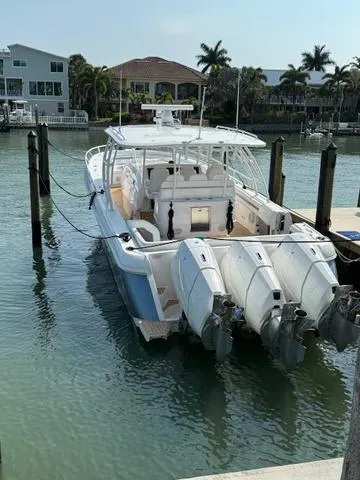 Slide: The Image of 2016 Intrepid Panacea boat docked with four powerful outboard engines. - 5