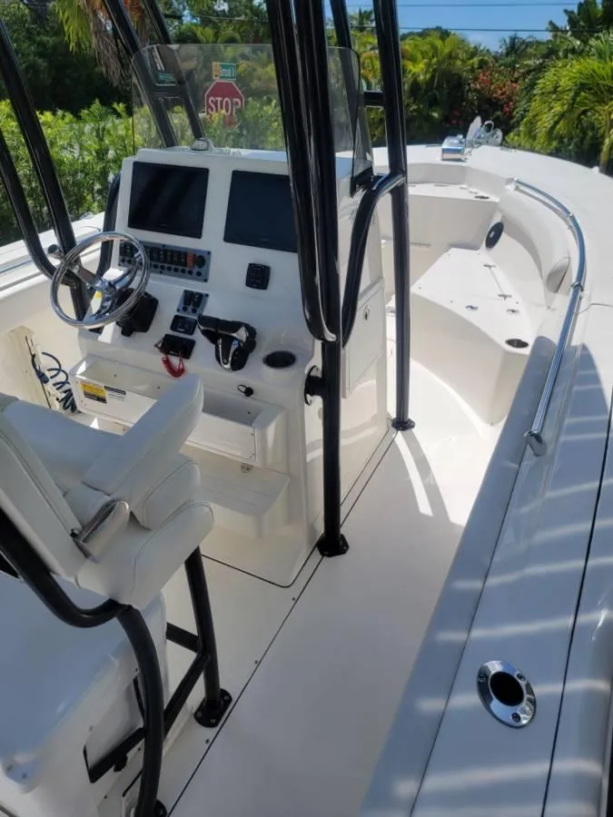 Slide: The Image of 2023 Key West 244 Center Console boat interior with modern controls and seating. - 10