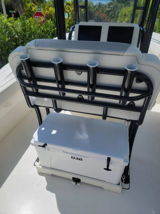 Slide: The Image of 2023 Key West 244 Center Console boat with rod holders and cooler. - 11