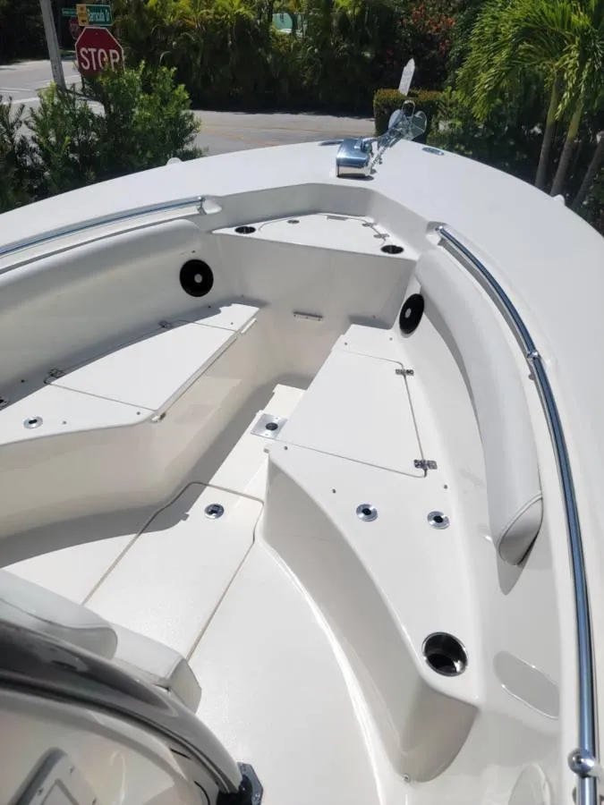 Slide: The Image of 2023 Key West 244 Center Console boat interior with seating and storage compartments. - 12