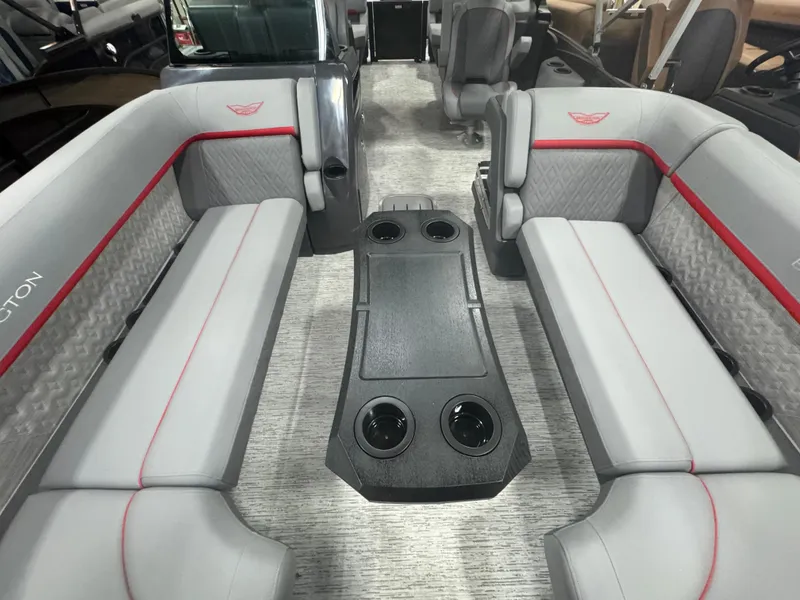 Slide: The Image of 2025 Bennington 24MFB-SPS (TC) pontoon boat interior with gray seating and central table. - 6