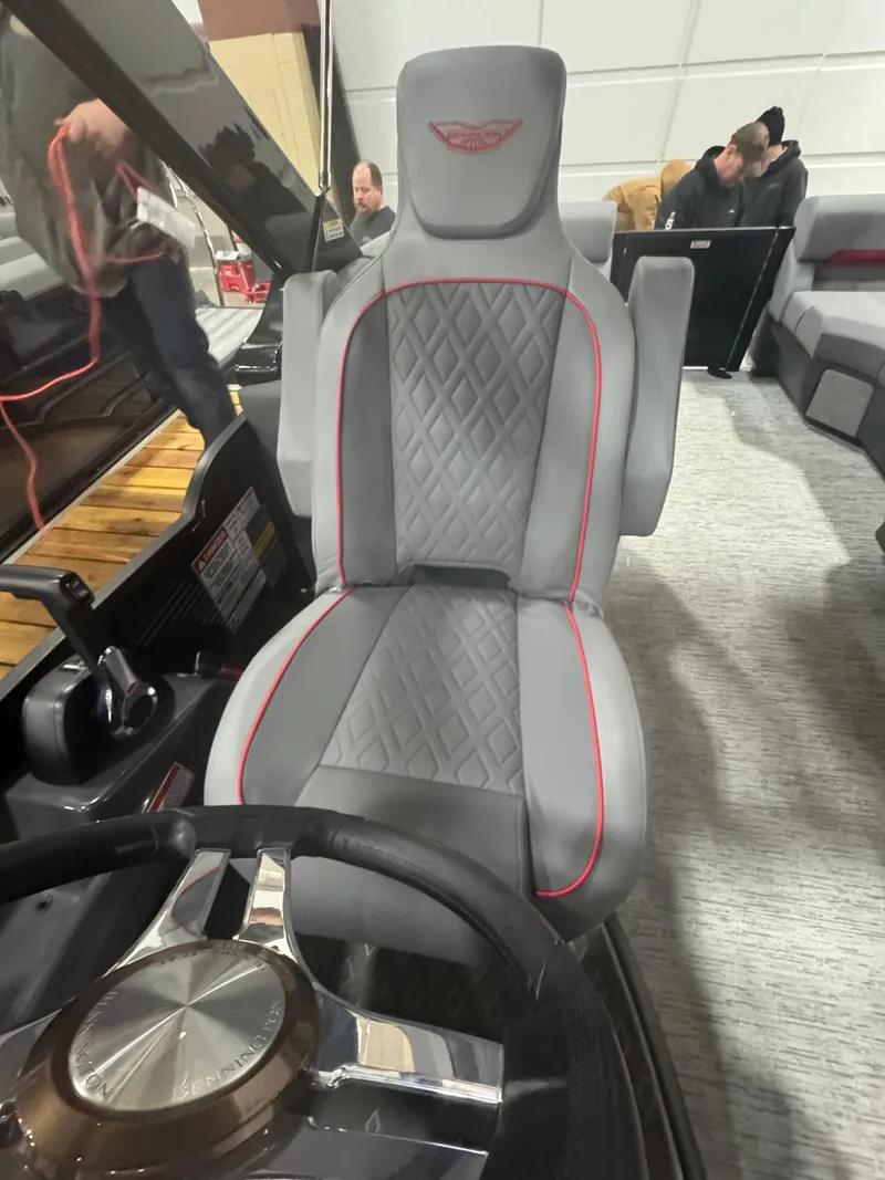 Slide: The Image of 2025 Bennington 24MFB-SPS (TC) boat seat with diamond stitching and red accents. - 9