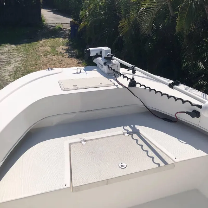 Slide: The Image of 2017 Dusky 227 XF boat deck with trolling motor and storage compartments. - 3