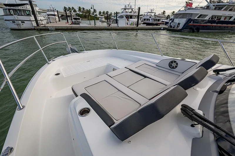 Slide: The Image of 2022 Jeanneau Leader 12.5 boat with sun loungers, docked at marina. - 19