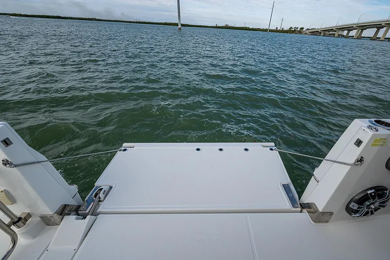 Slide: The Image of 2022 Jeanneau Leader 12.5 boat swim platform on calm water. - 28