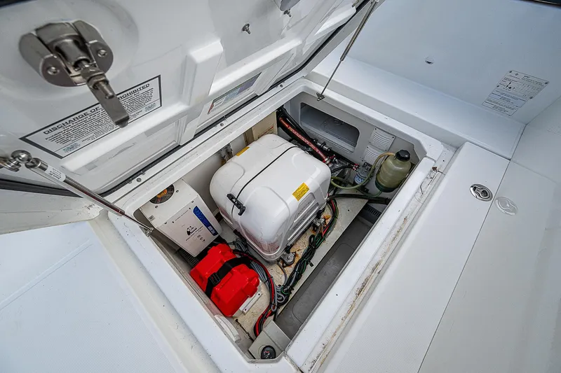 Slide: The Image of Engine compartment of 2022 Jeanneau Leader 12.5 boat, showcasing mechanical components. - 30
