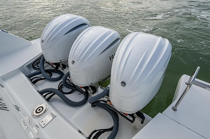 Slide: The Image of Triple Yamaha outboard engines on 2022 Jeanneau Leader 12.5 boat. - 33