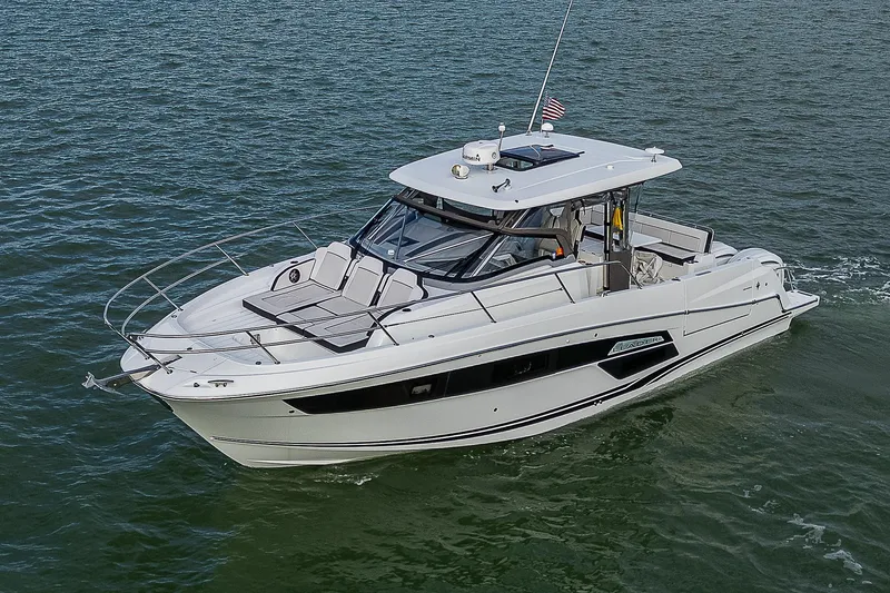 Slide: The Image of 2022 Jeanneau Leader 12.5 boat cruising on open water. - 35