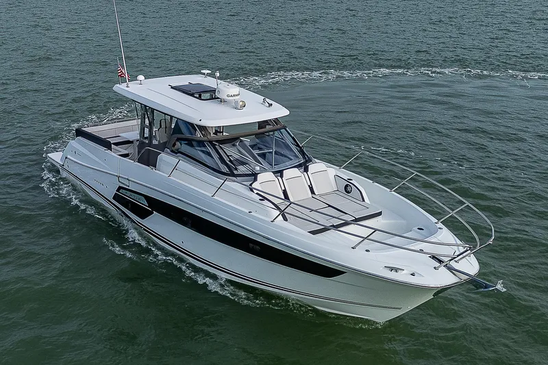 Slide: The Image of 2022 Jeanneau Leader 12.5 cruising on open water, showcasing sleek design and modern features. - 36