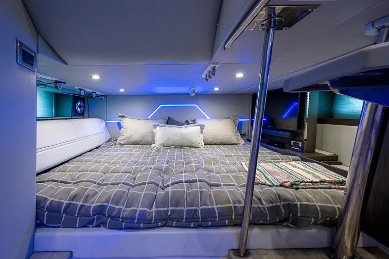 Slide: The Image of Luxurious interior of 2022 Formula 430 All Sport Crossover with modern bedding and ambient lighting. - 10