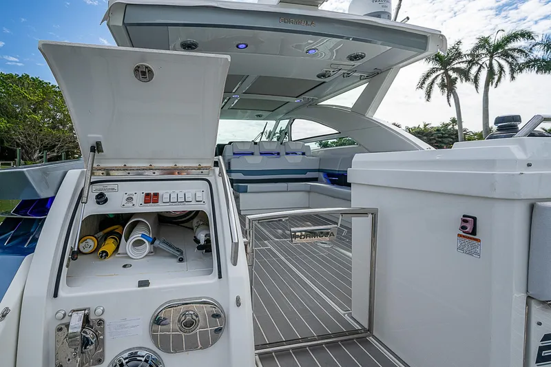 Slide: The Image of 2022 Formula 430 All Sport Crossover yacht with open storage compartment and sleek deck design. - 22
