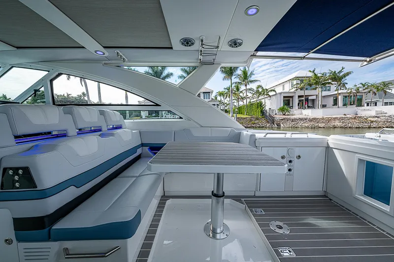 Slide: The Image of 2022 Formula 430 All Sport Crossover yacht interior with seating and table, featuring modern design. - 32