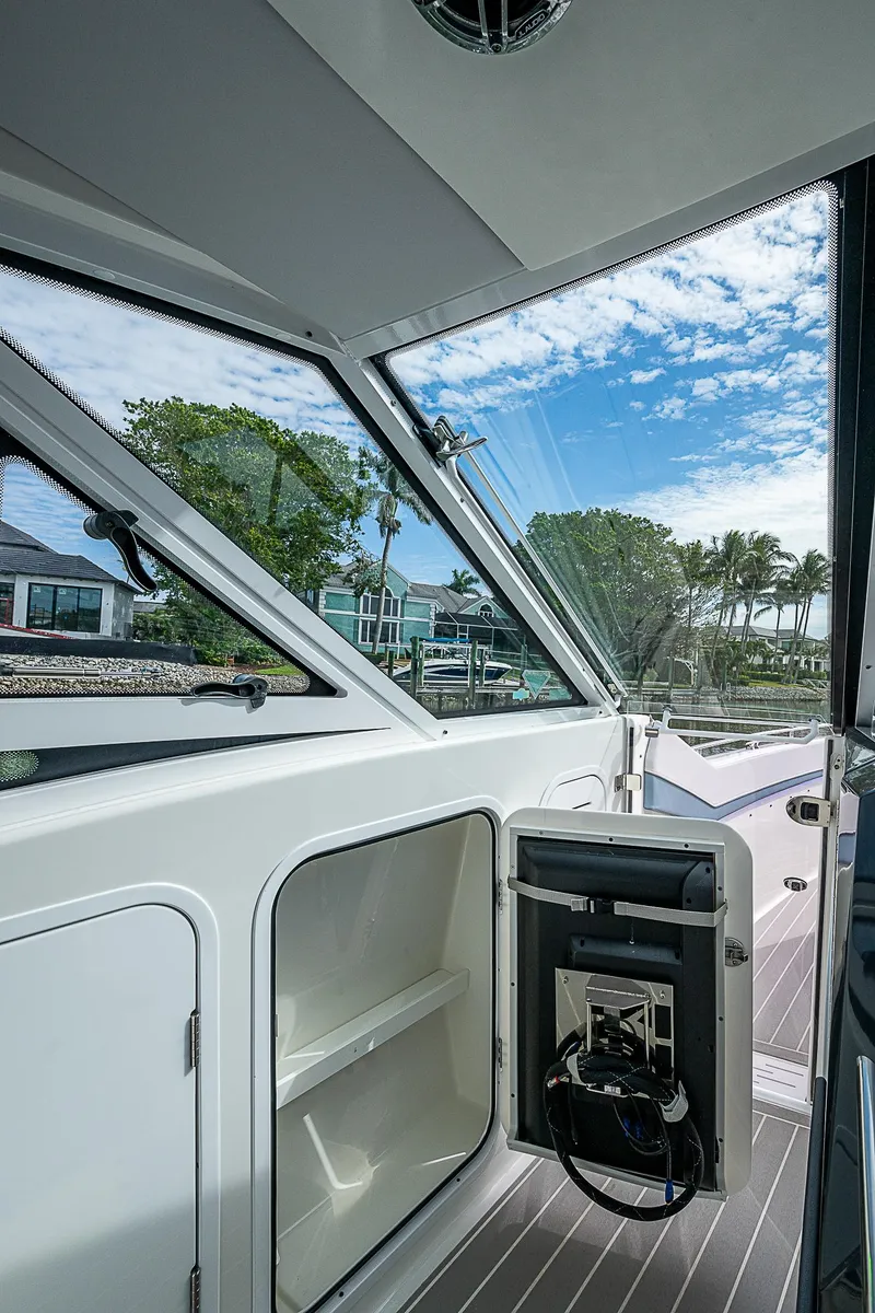 Slide: The Image of 2022 Formula 430 All Sport Crossover boat interior with open storage compartment. - 36