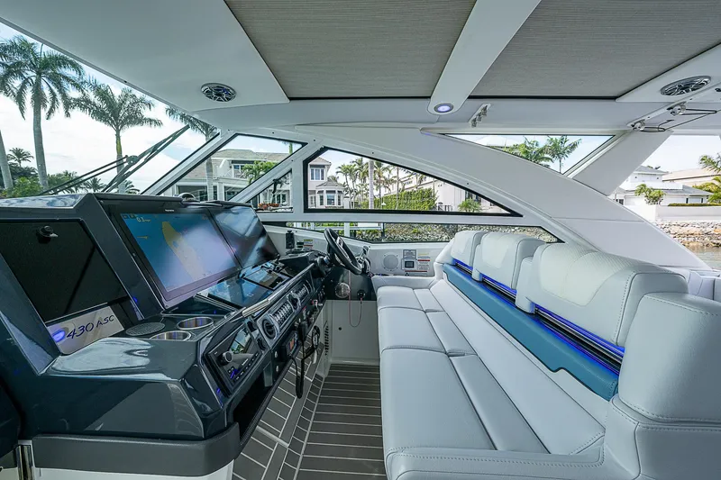 Slide: The Image of Interior of 2022 Formula 430 All Sport Crossover yacht with modern dashboard and seating. - 39
