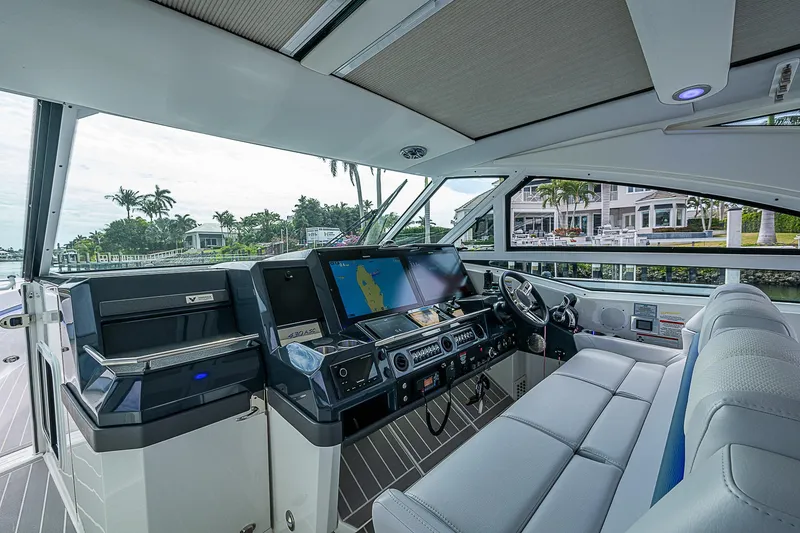 Slide: The Image of 2022 Formula 430 All Sport Crossover yacht interior with modern helm and seating. - 6